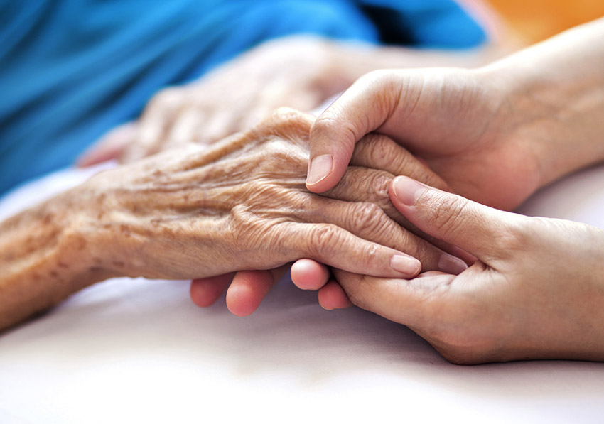 person holding hands with a patient