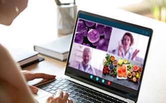 Person looking at a laptop with images about pancreatic cancer