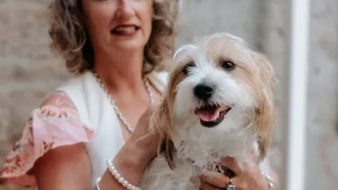 Judi with her adopted dog