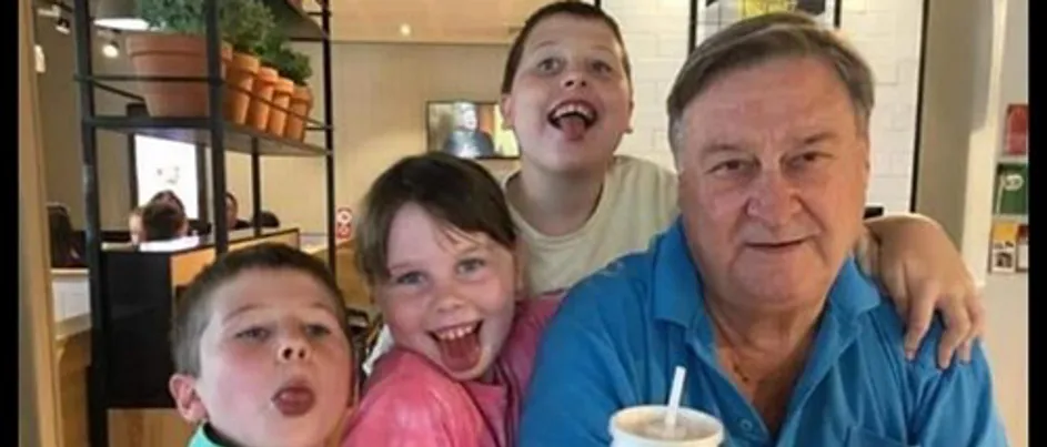 Megan's dad surrounded by his grandchildren.