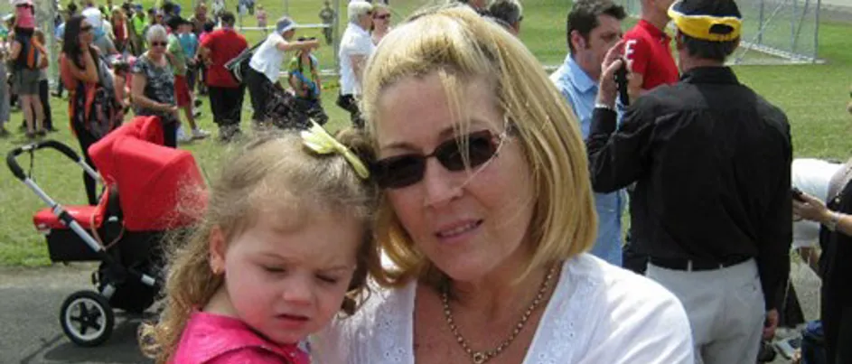 Maree holding her granddaughter.