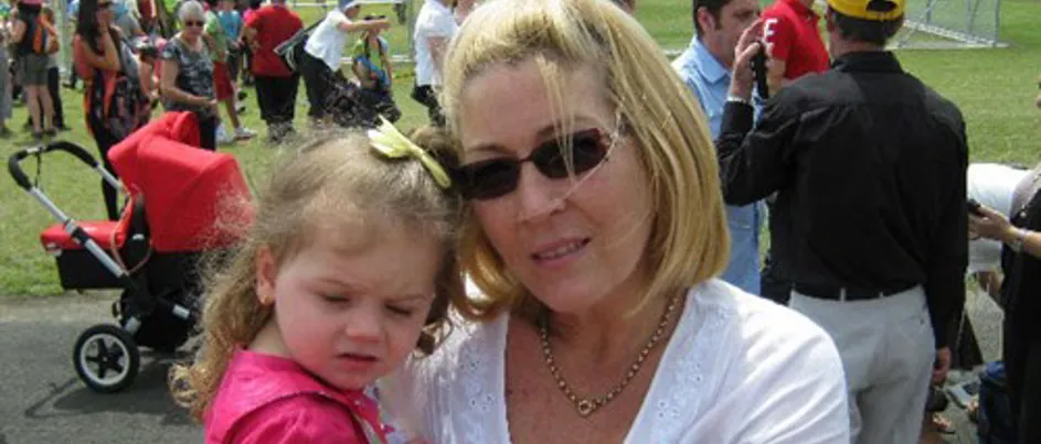 Maree holding her granddaughter.