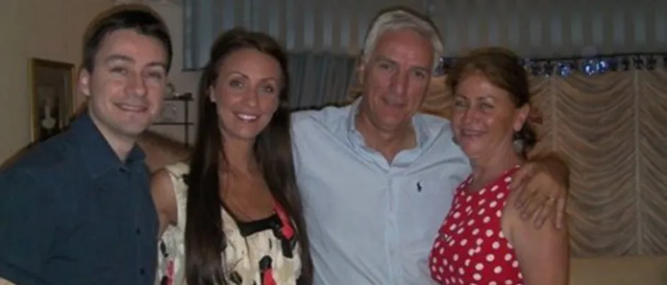 Jacqueline standing next to her brother, father and mother.