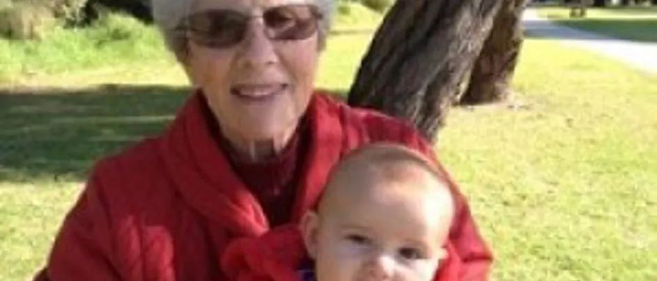 Krystyna's mum Irena, sitting with her granddaughter on her lap.