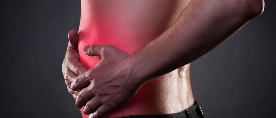 man experiencing abdomen pain due to pancreatic cancer