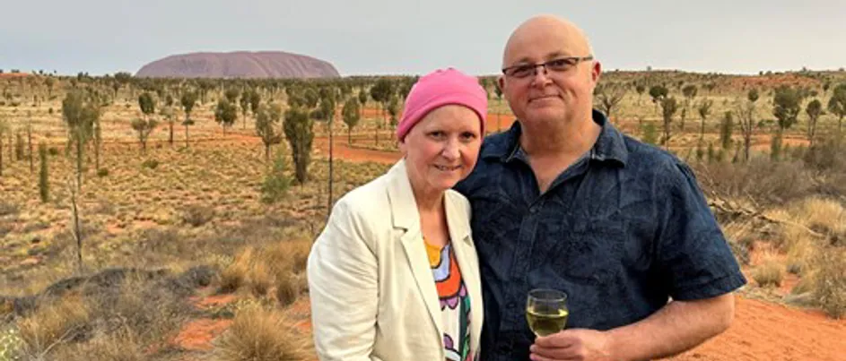 Suzanne and her husband at Uluru.