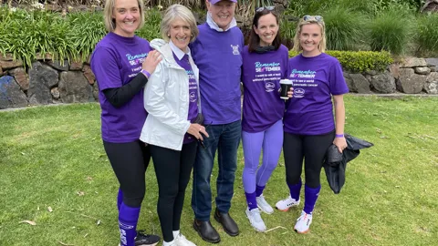 Emily with her father, sisters and mother at a Pankind event