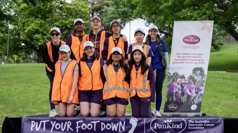 Emily with her students, volunteering at a Pankind fundraiser walk