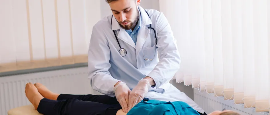 Doctor pressing patient belly abdomen - detect pancreatic cancer early