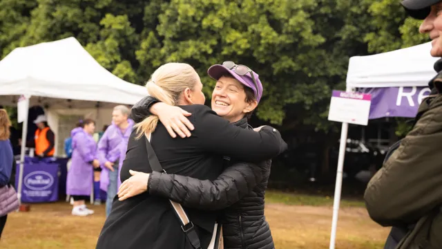 Pancreatic cancer founder Carolin Kelly hugging CEO Michelle Stewart