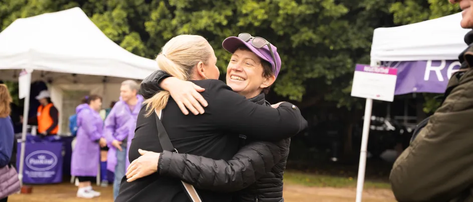 Pancreatic cancer founder Carolin Kelly hugging CEO Michelle Stewart