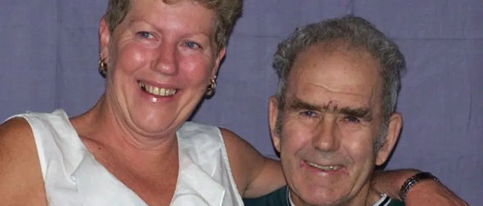Joanne and her father Ray sitting together smiling.