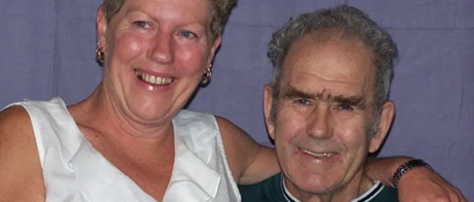 Joanne and her father Ray sitting together smiling.