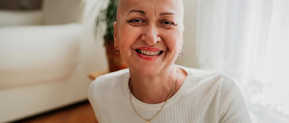 A woman with pancreatic cancer, smiling.